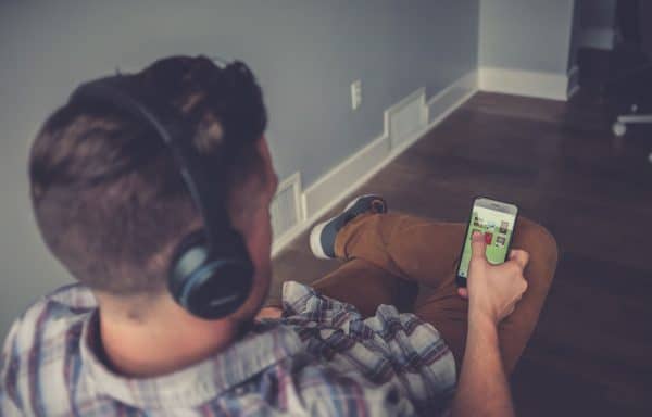 Picture Man with headphone and mobile phone